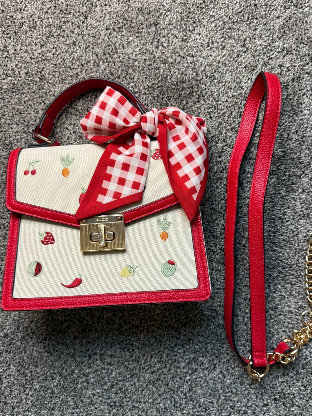 Aldo Cream and Red Fruit-Embroidered Top Handle Bag with Red Gingham Bow.